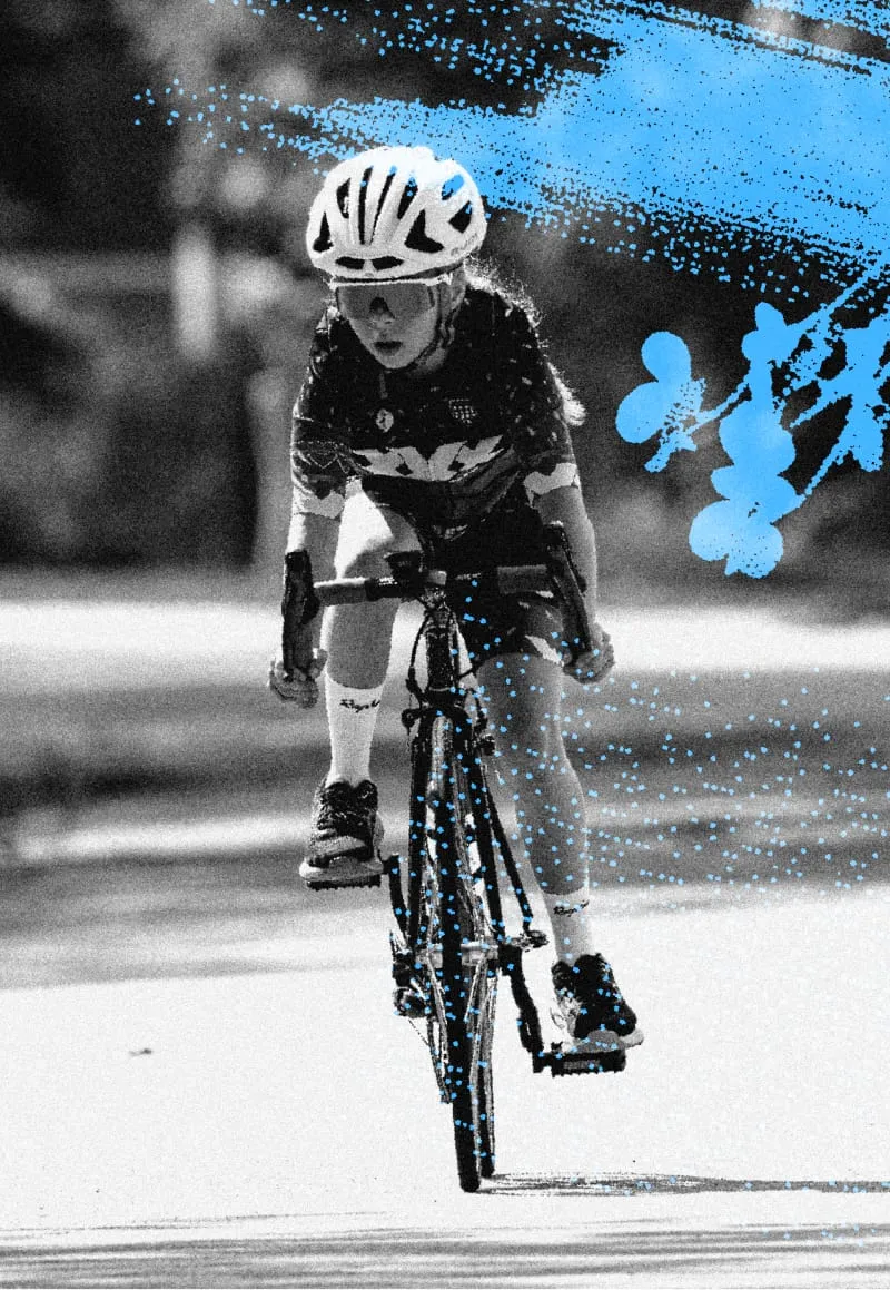A junior Illinois Cup rider races toward the camera with blue graphic accents overhead.